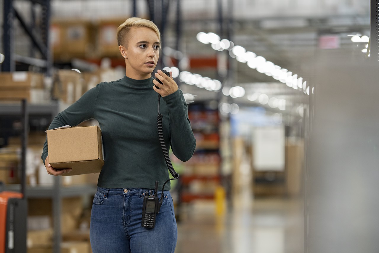Woman with Motorola radio in a retail store